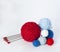 Bright knitting balls and knitting needles on a white background. There is a place for text nearby