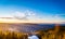 Bright Lake Mummelsee at sunrise, overlooking mountains landscape