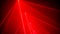 Bright laser show installation with red color rays or beams in dark room