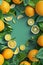 Bright lemon top view mockup. Lemon and green branches in layered paper cut style. Green background, vibrant citrus fruits, empty