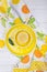 Bright lemon on a yellow plate. Wooden background. Top view, free space