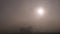 Bright Light of the Rising Sun Breaks through Thick Morning Fog. 4K. Close up
