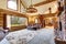 Bright Living room interior in American log cabin house.