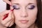 Bright makeup. Makeup artist brings eyelashes