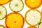Bright mandarin, lemon and lime slices on white