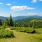 Bright mountain landscape and sky with white clouds