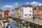 Bright multi-colored houses on the island of Burano, one of the city blocks of Venice. Venice,