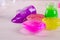 Bright multi colored slimes on a table. Kids popular toy of nowadays. Slime in plastic containers