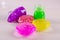 Bright multi colored slimes on a table. Kids popular toy of nowadays. Slime in plastic containers