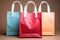 Bright multicolored bags for packing craft goods on a beige background. Mockup