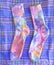 Bright multicolored socks are hand painted