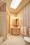 Bright narrow bathroom interior
