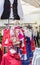 Bright national Hungarian clothes hanging on hangers in the street store