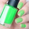 Bright neon green manicure with geometric pattern lines