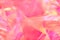 bright neon pink, magenta, orange holographic metallic foil festive background