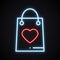 Bright neon shopping package with heart sign. Glowing present. Happy Valentine`s day symbol.