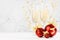 Bright New Year background - two fizz champagne wineglasses, shine christmas decoration - red balls, golden ribbon, curling.