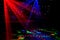 Bright nightclub red, green, purple, white, pink, blue laser lights cutting through smoke machine smoke making light and rainbow