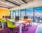 Bright Office Space With Desks, Chairs, And Panoramic Windows With City View