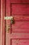 Bright but old wooden door with gorgeous owl lock at it. Entrance door closed with a cute lock