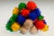 Bright, olourful pom poms in a pile