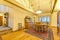 Bright, open and warm dining room with vaulted ceilings and rug