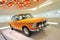 Bright orange BMW 2002 TI classic car on display in BMW Museum