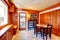 Bright orange dining room with black wooden table set