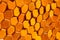 Bright orange hexagonal honeycomb tile background