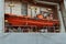 A bright orange lifeboat on an army warship. Riga, Latvia - 30 Oct 2022