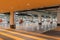 Bright orange pedestrian crossing in an underground car park under shopping mall.