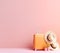 Bright orange suitcase and two straw hats. Stylish luggage bags on pink background with blank space for text. Travel and vacation