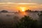 Bright Orange Sun Rises Over Foggy Morning In The Everglades