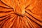 bright orange velvet material draped over a round shape