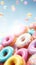 Bright pastel color frosted assorted donuts levitating, blue sky background