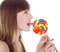 Bright picture of happy blondie with color lollipop