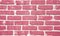 Bright pink brick wall