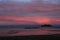 Bright pink clouds over Lake Vanern, Sweden. Sunrise view from Vita Sannar, Mellerud community