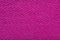 bright pink fine grain felt fabric. fiber texture polyester close-up. pink fleecy background. shaggy surface