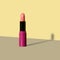 Bright pink opened lipstick on grey and yellow backdrop with shadow. Minimal fashion cosmetic make up background