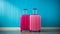 Bright pink suitcases on vibrant blue backdrop, travel luggage set for vacation and adventures