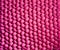 Bright pink uneven, bumpy background texture