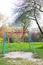 A bright playground surrounded by greenery, a beautiful and cozy park for the whole family