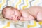 Bright portrait of cute sleeping 14 days newborn baby boy