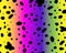 Bright rainbow dalmatian pattern seamless pattern. Black uneven spots animal print. Vector background.