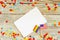 Bright rainbow gay flag on wooden background, paper confetti top view with space for text, mocup, copy space. LGBT community.