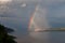 The bright rainbow over the big river.