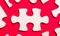 On a bright red background, white puzzles. One of the puzzle pieces has a place to insert text. Template