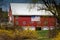 Bright red barn with equally bright white roof in Hillsborough County