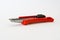 Bright Red Box Cutter Metal Blades New Clean Object White Background